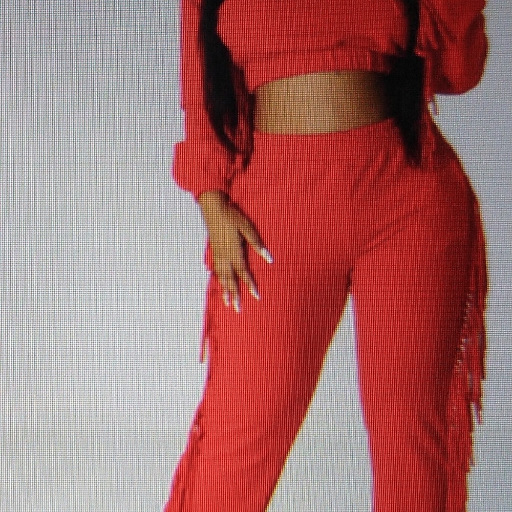 2 piece sweat suit, with tassels down the sides of the arms and legs